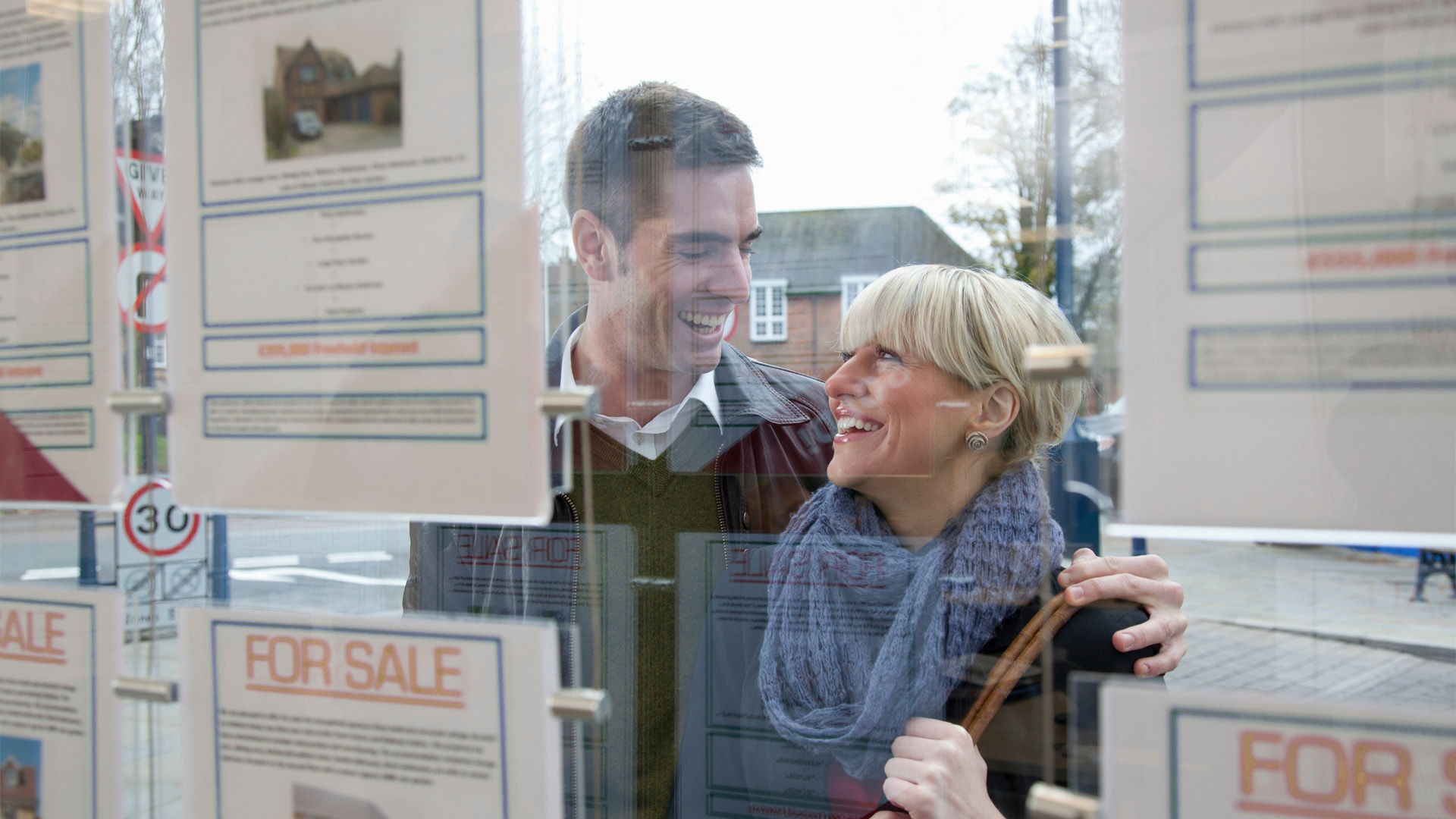 couple outside an estate agent
